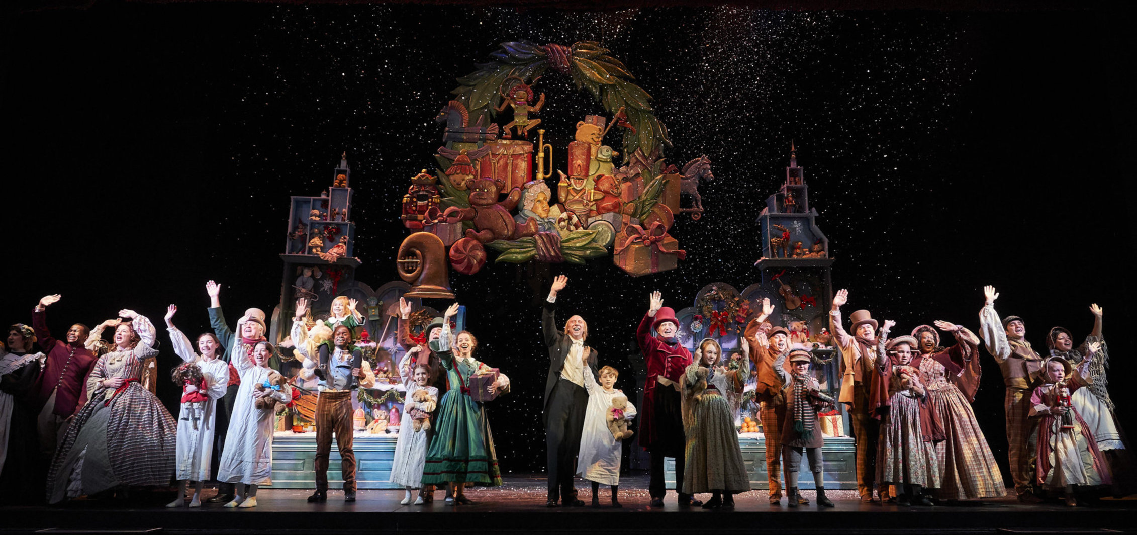 A christmas carol cast waving