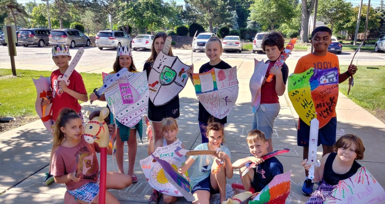 Children with paper shields