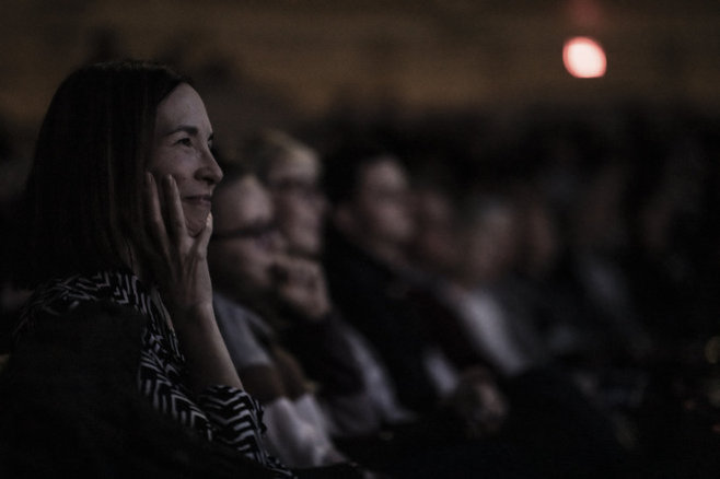 Woman with hand on face